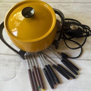 Vintage West Bend mustard yellow fondue pot with 11 pokers for dipping